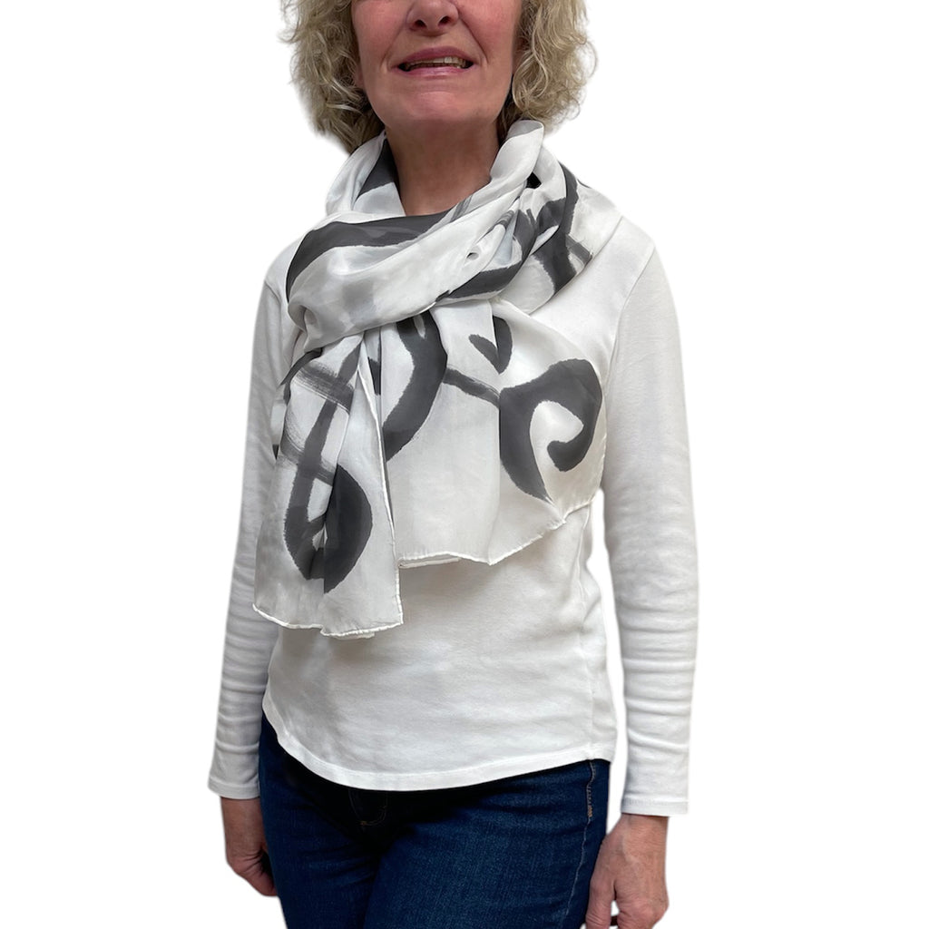 Black hand painted, rectangle off white silk scarf.