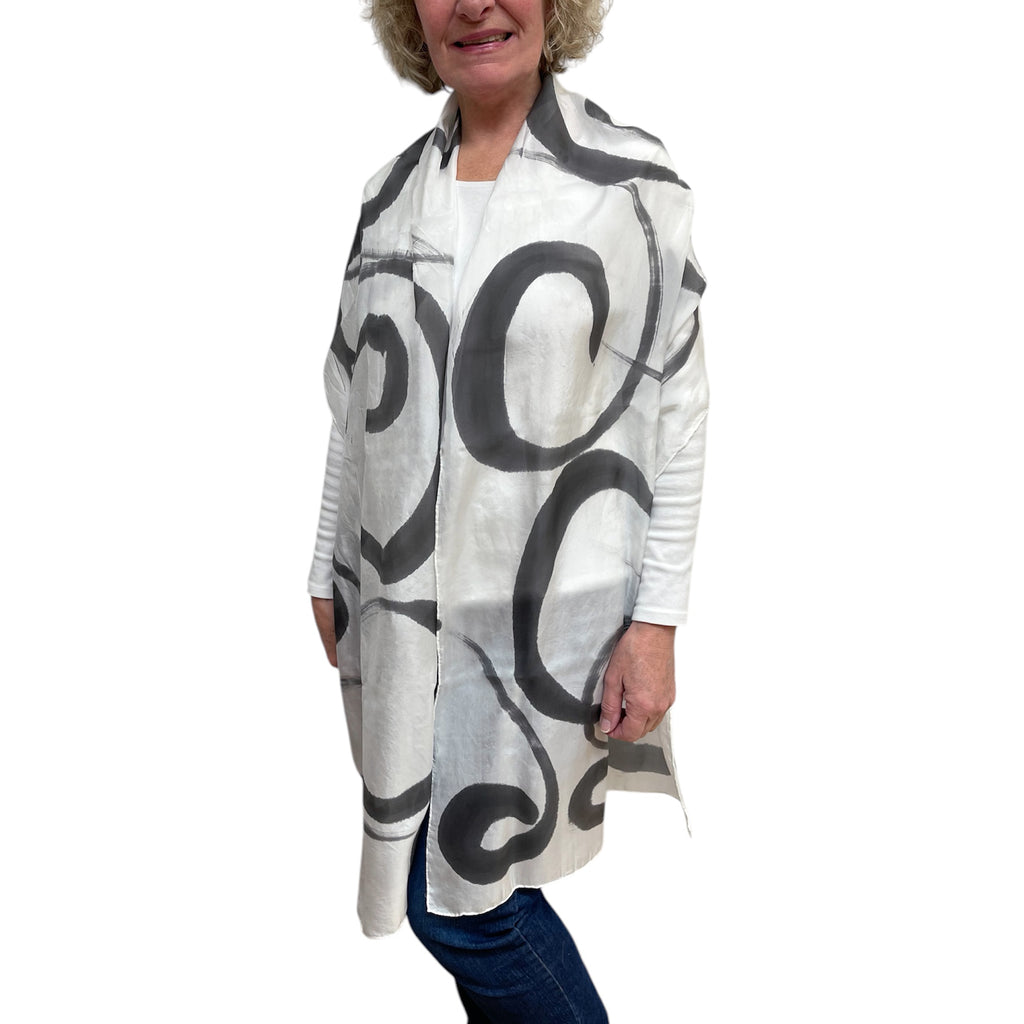 Black hand painted, rectangle off white silk scarf.