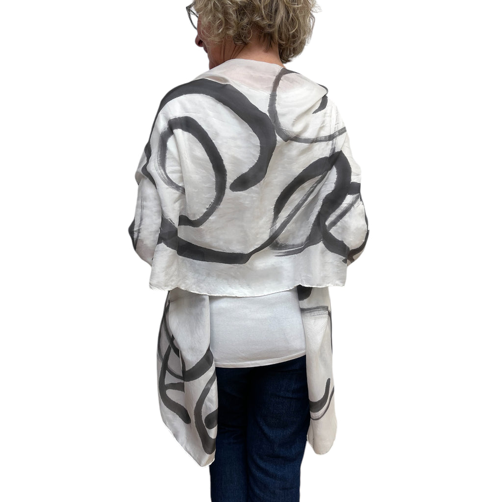 Black hand painted, rectangle off white silk scarf.